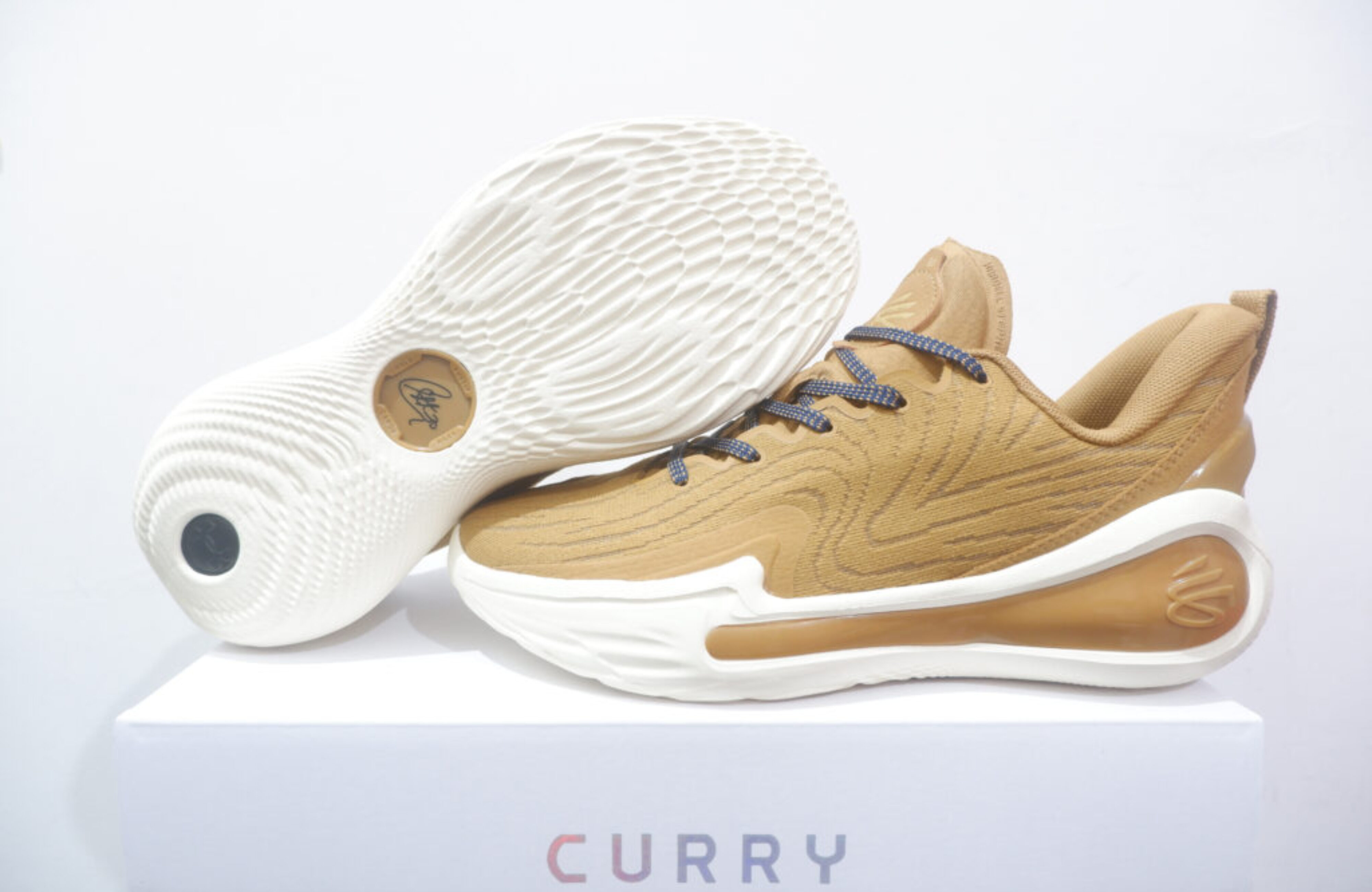 UA CURRY FLOW 12 LOW COZY BROWN